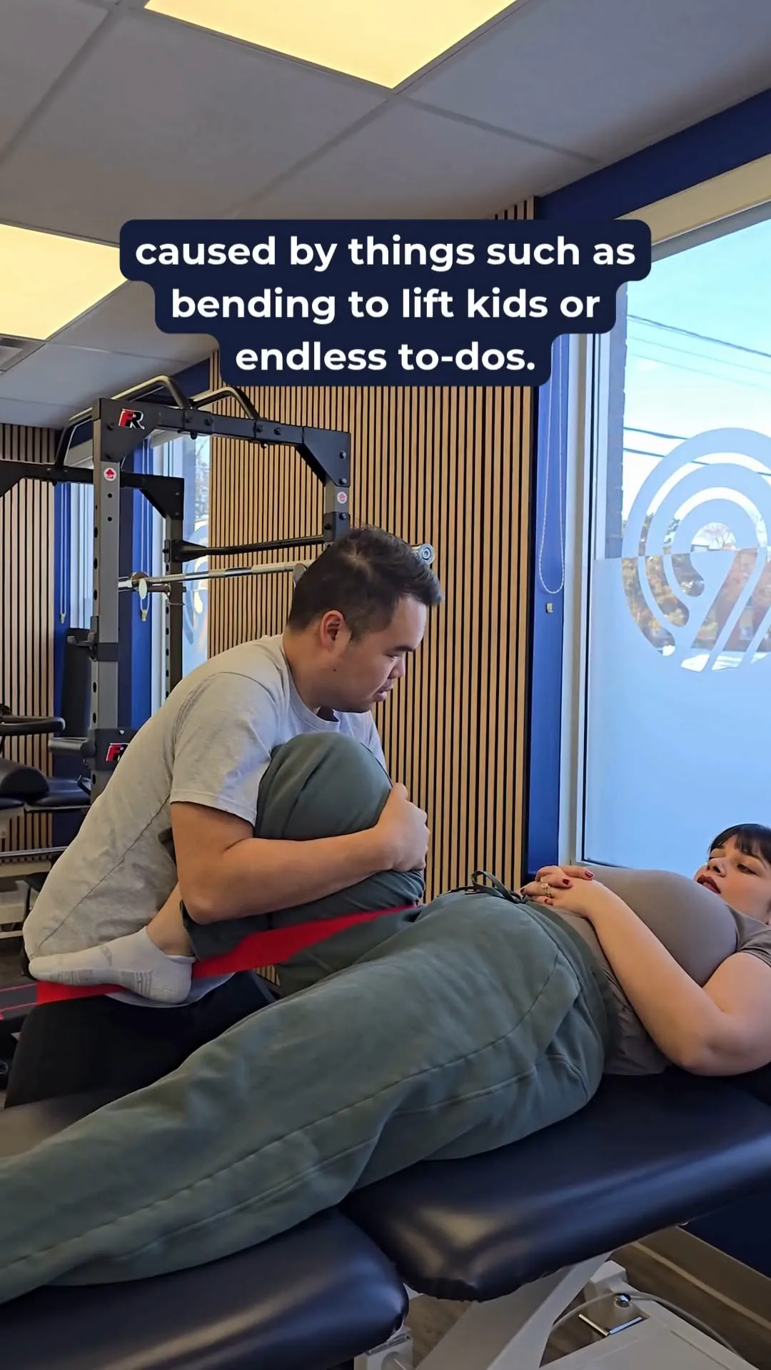 Simon Luu performing manual therapy on a patient’s lower back